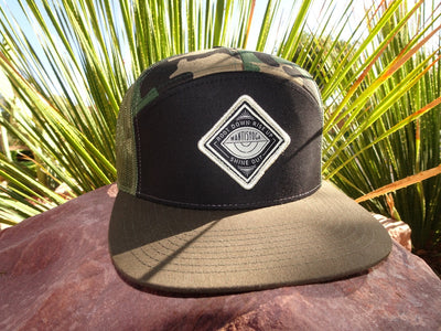 Root to Rise Camo Trucker Hat outside
