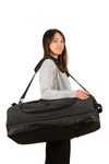 retreat duffel pack in use with shoulder strap woman