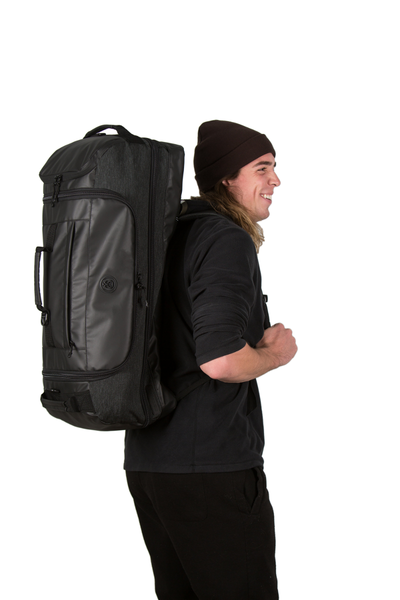 retreat duffel pack side view with backpack straps on